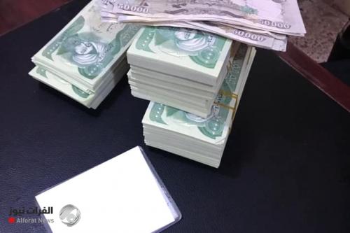 بالصور.. القبض على عصابة لترويج العملة المزيفة في بغداد